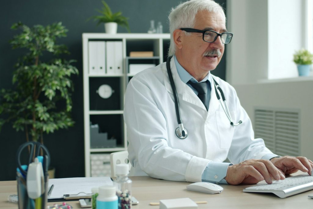 Doctor working at a desk in a private clinic
